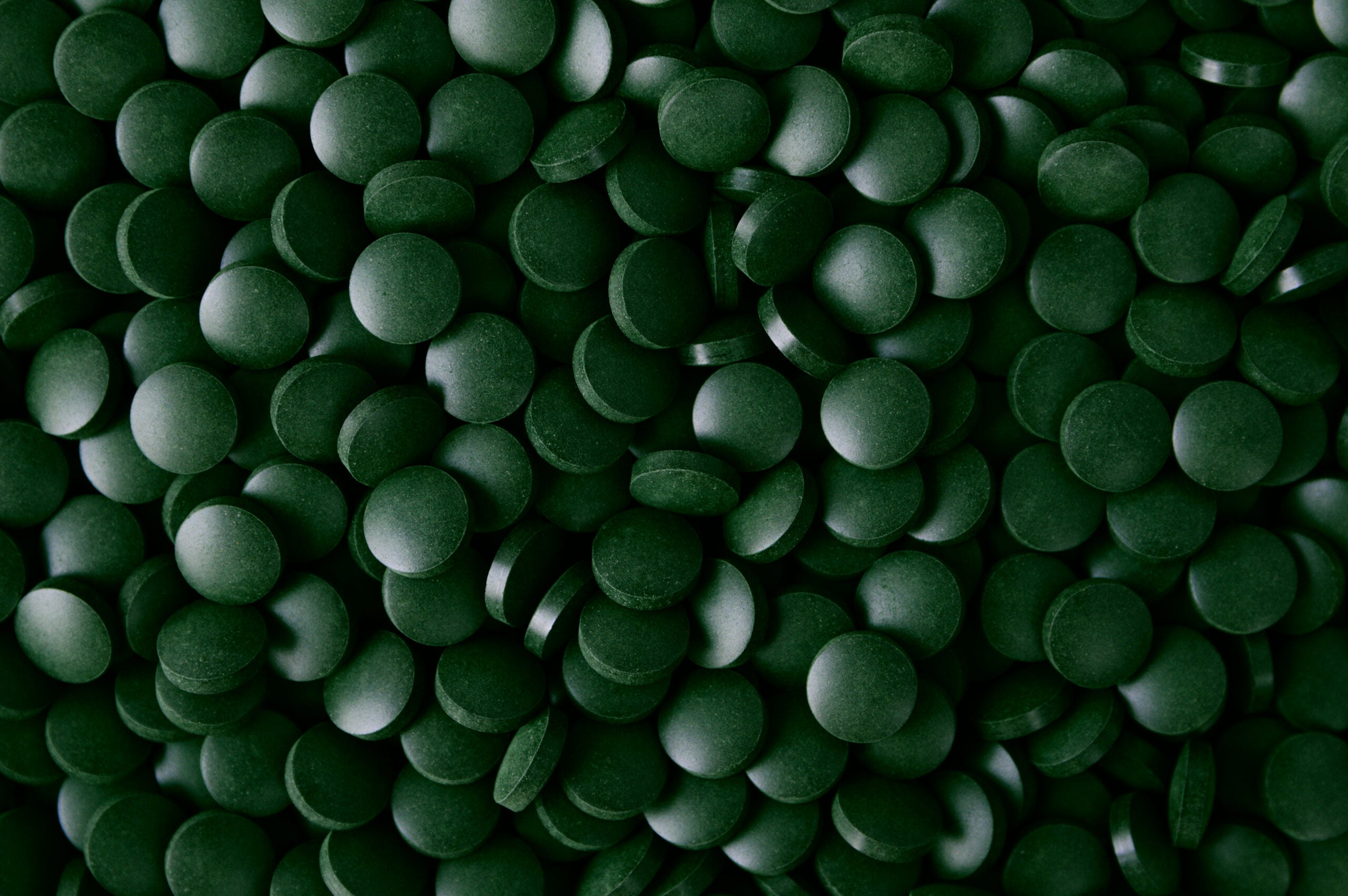 Dark green texture background of Spirulina supplement for dietary Image