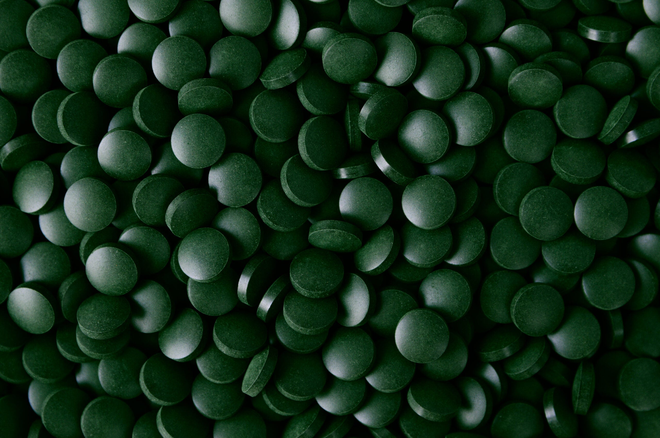 Dark green texture background of Spirulina supplement for dietary Image